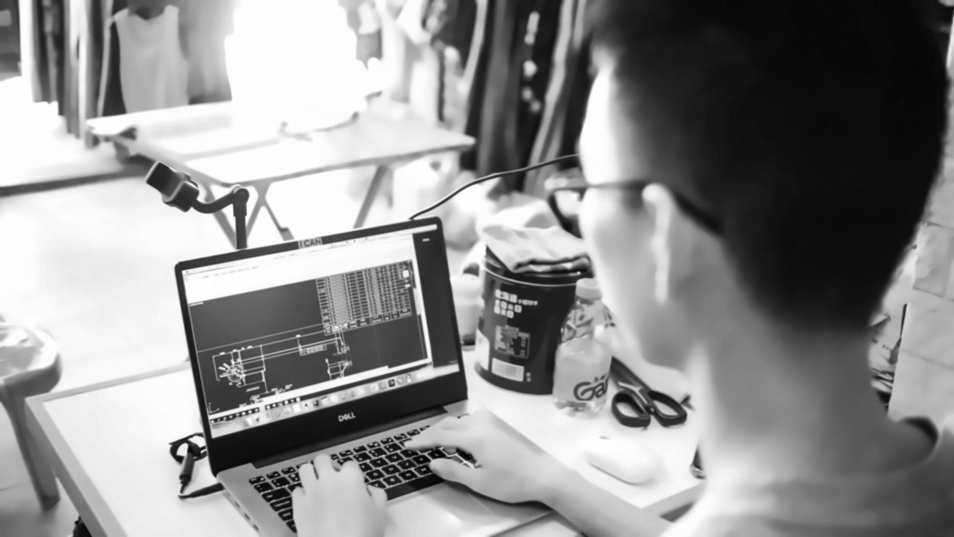 Professional web design workspace with multiple devices showing responsive layouts